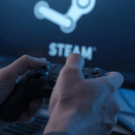 tangan gamer memegang controller di depan layar Steam